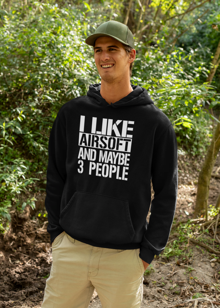 mockup-of-a-happy-man-wearing-a-hoodie-in-the-woods-32227-1.png Mikina s potlačou – I like airsoft and maybe 3 people – Obrázok 1